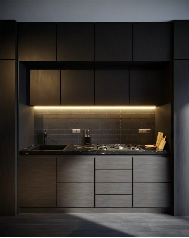 Handle-less dark modular kitchen with quartz countertop and integrated hob in Delhi apartment