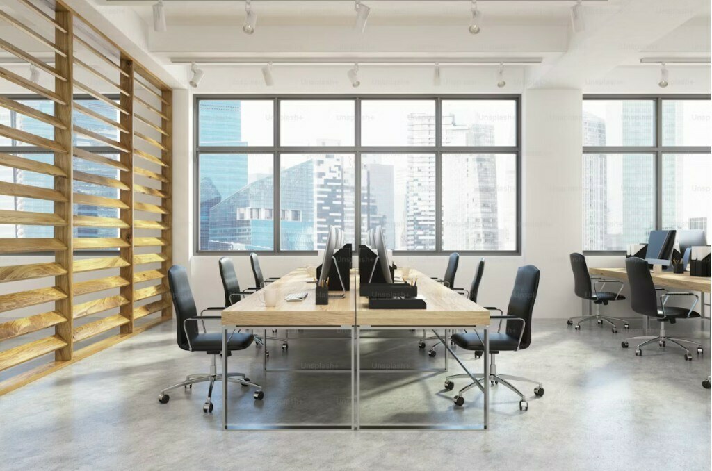 Executive lounge office interior with boucle guest chairs and marble floor in Noida commercial project